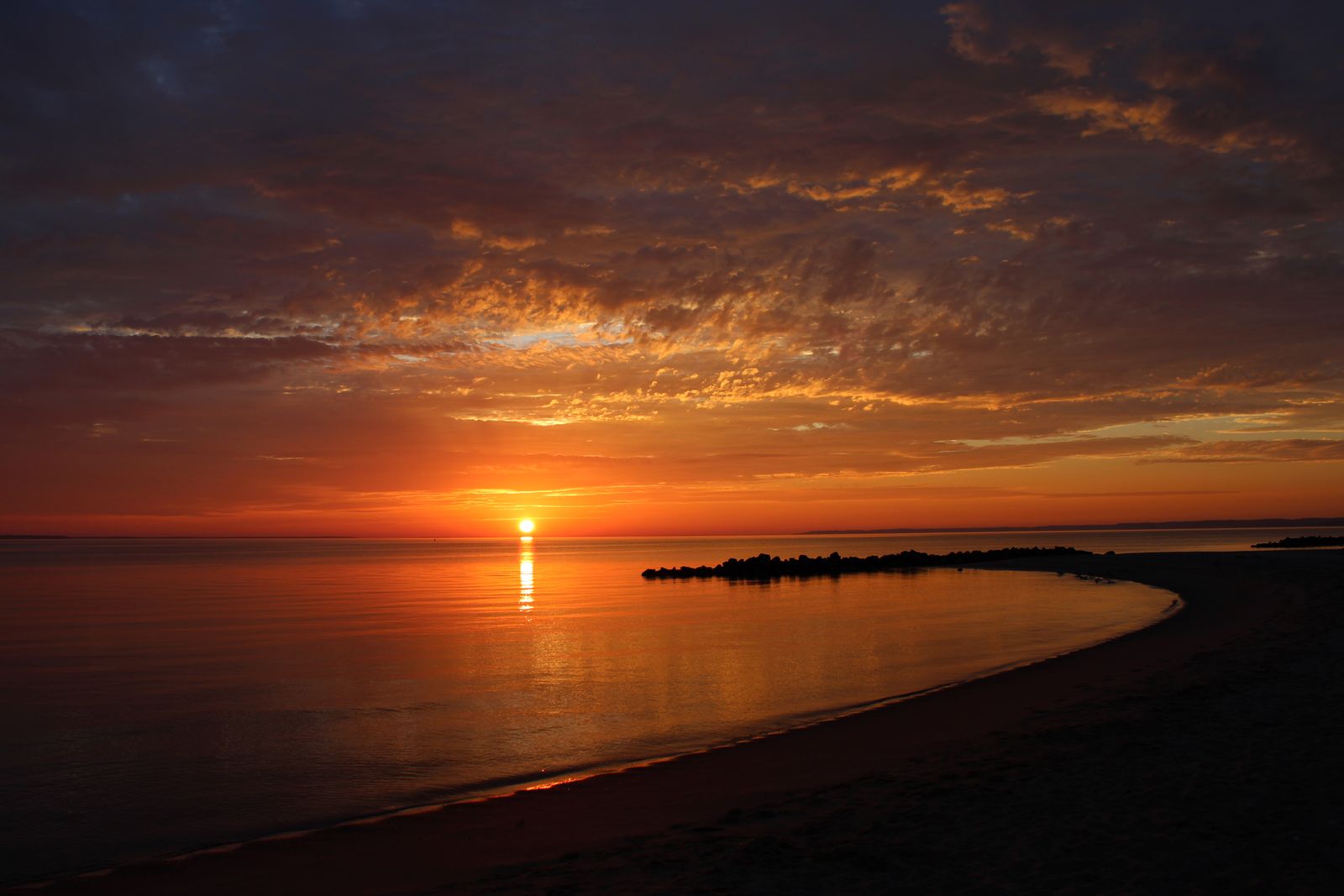 Golden sunset over the ocean horizon
