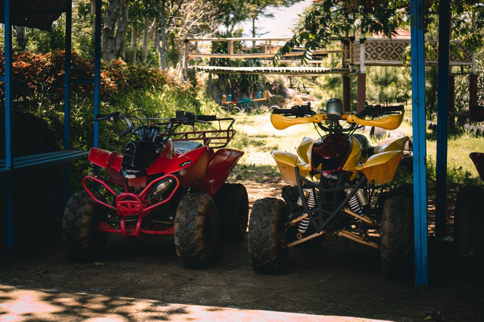 Quad bikes parked in the shade ready for a tour